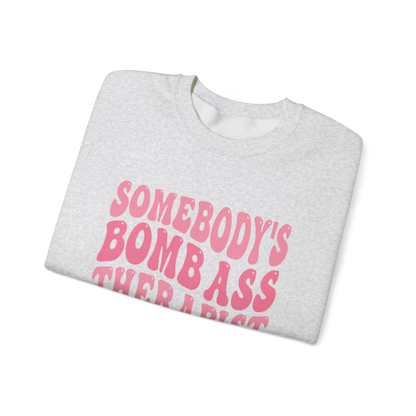 Somebody’s Bomb Ass Therapist (Pink) Crewneck Printify