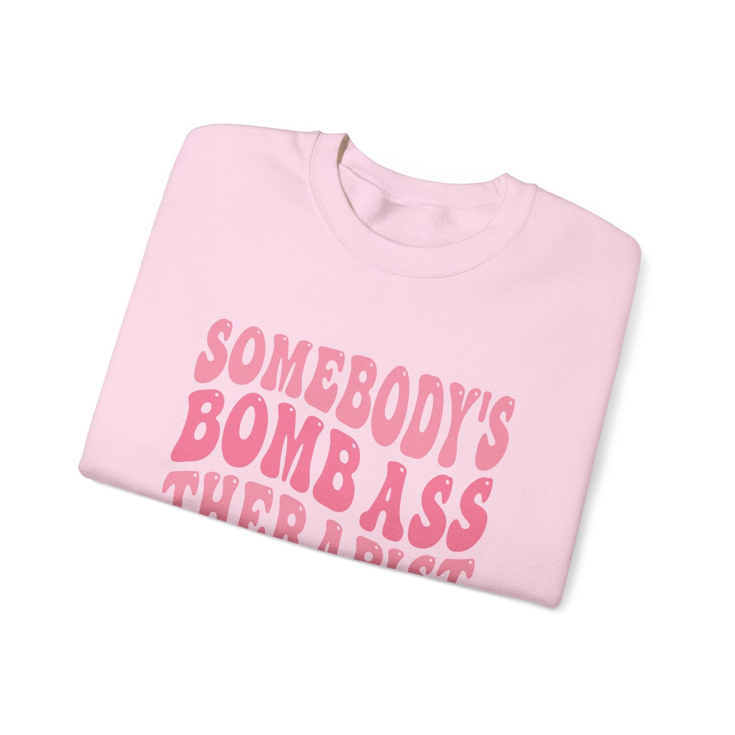 Somebody’s Bomb Ass Therapist (Pink) Crewneck Printify