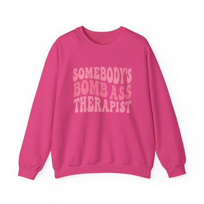 Somebody’s Bomb Ass Therapist (Pink) Crewneck
