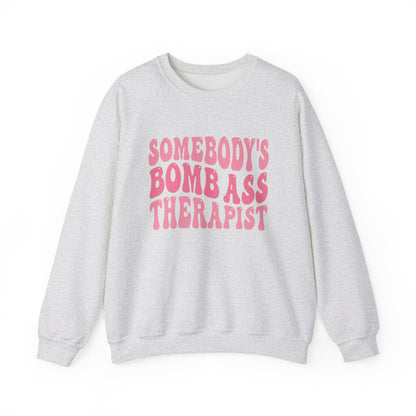 Somebody’s Bomb Ass Therapist (Pink) Crewneck