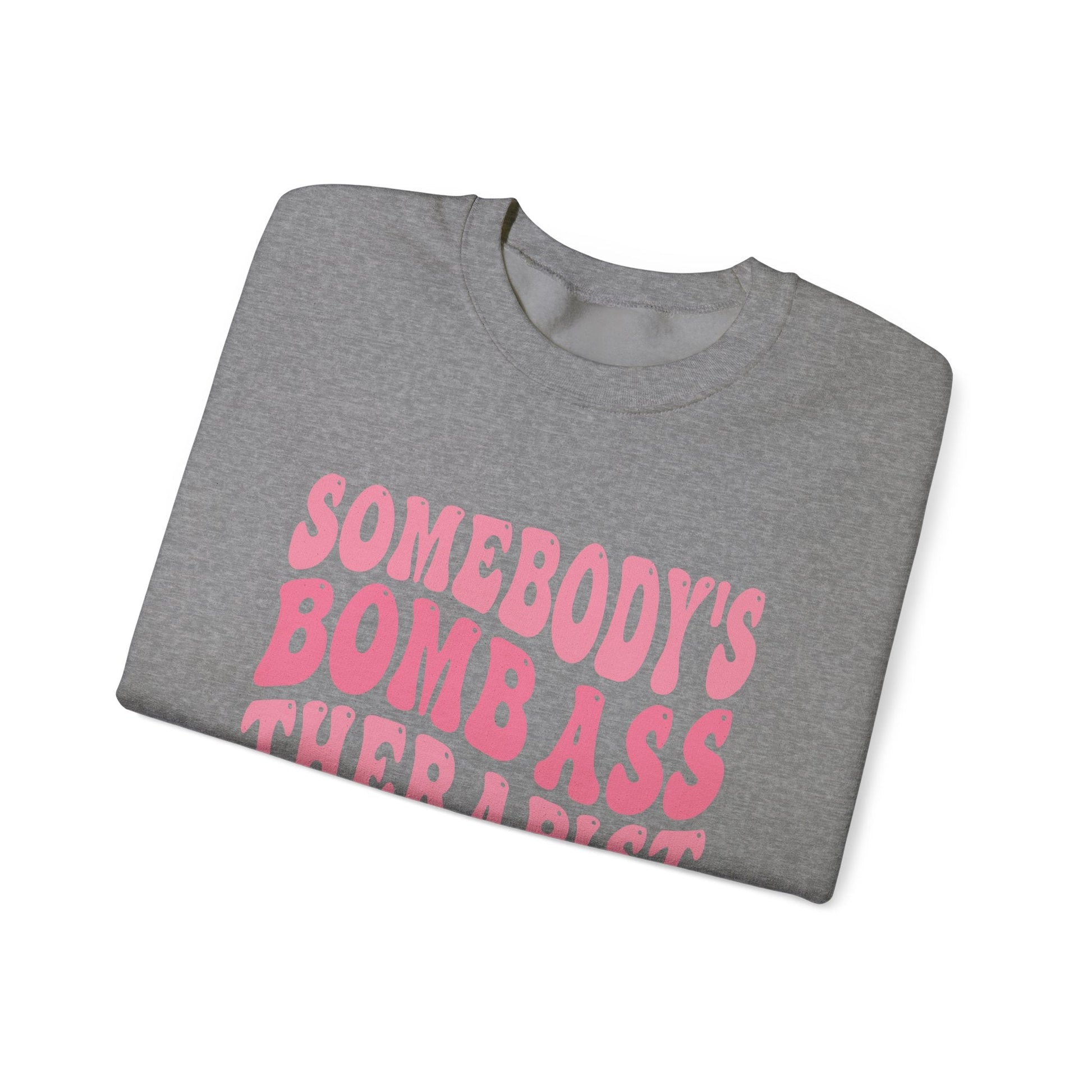 Somebody’s Bomb Ass Therapist (Pink) Crewneck Printify