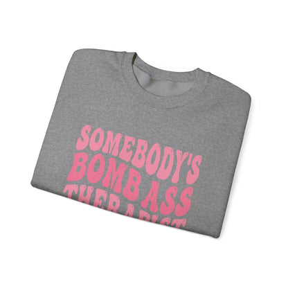 Somebody’s Bomb Ass Therapist (Pink) Crewneck Printify