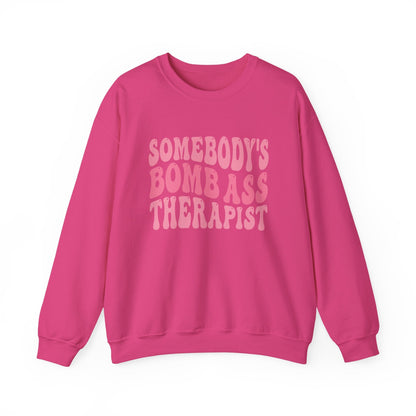 Somebody’s Bomb Ass Therapist (Pink) Crewneck Printify