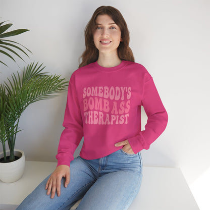 Somebody’s Bomb Ass Therapist (Pink) Crewneck
