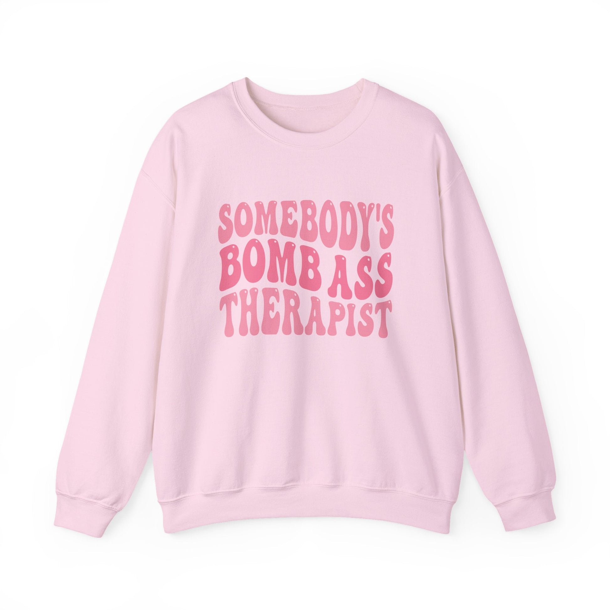 Somebody’s Bomb Ass Therapist (Pink) Crewneck Printify