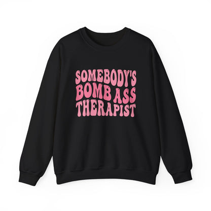 Somebody’s Bomb Ass Therapist (Pink) Crewneck Printify