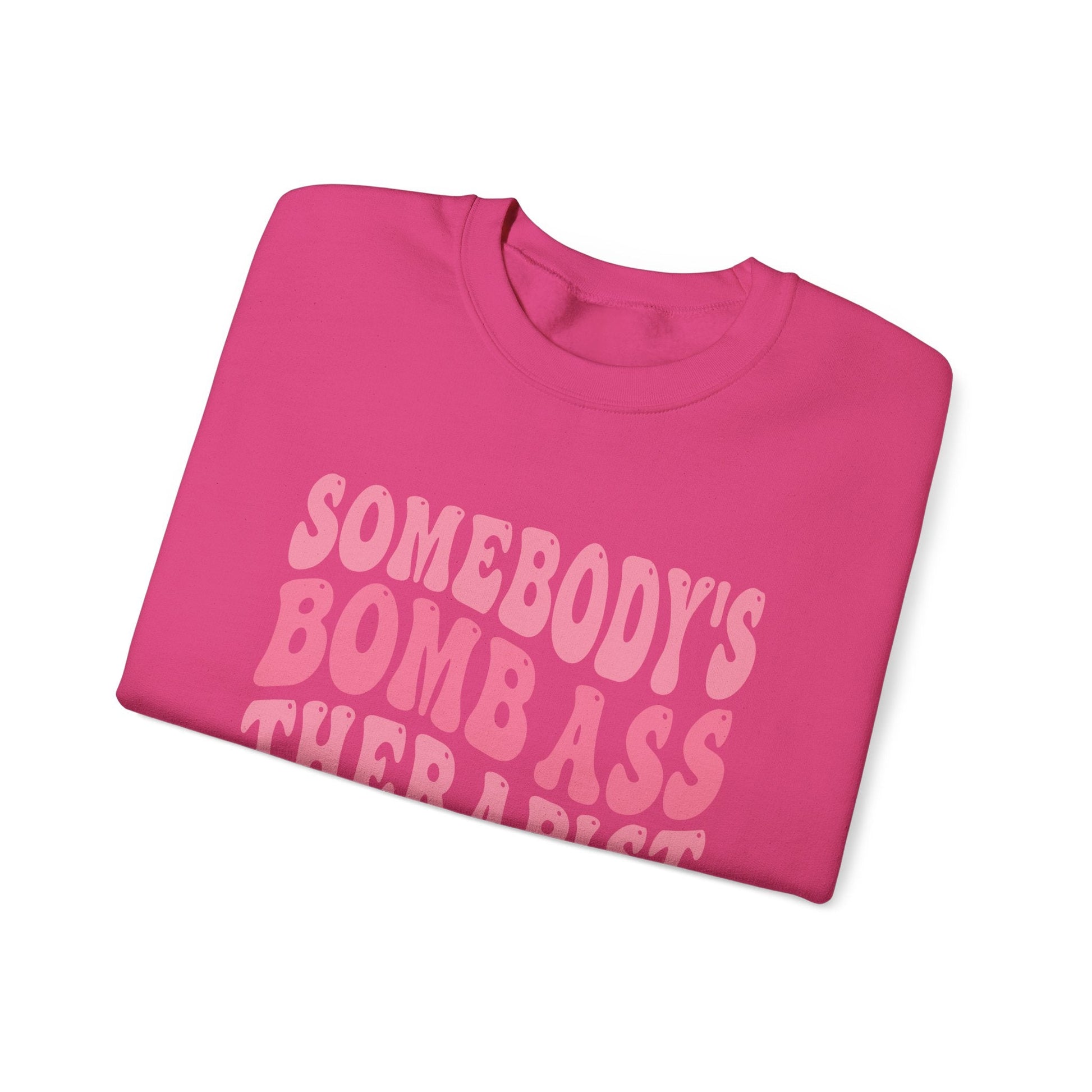 Somebody’s Bomb Ass Therapist (Pink) Crewneck Printify