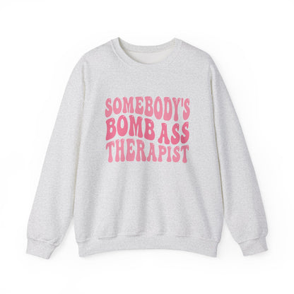 Somebody’s Bomb Ass Therapist (Pink) Crewneck Printify